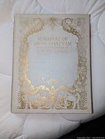 Front cover: gilt-stamped stiff vellum binding with peacock and elephant motif