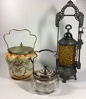 Photo showing all three items in the set: pickle cruet, jam jar, biscuit jar
