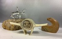 Group shot showing glass moose, aboriginal carving, and eagle carving