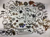 Overview of all jewelry pieces laid out on white surface