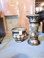 Photo showing both the ceramic pot and the matching pedestal stand together from an angled frontal view
