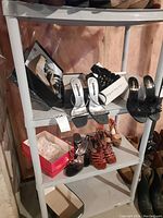 Seven pairs of high heel sandals displayed on white shelves, various styles and colors visible