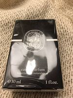 Front view of the Diptyque Eau Rose perfume box showing brand logo, scent name, and size information.