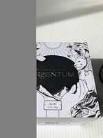 Front and partial side view of Argentum mask box with artistic lion and hand illustrations and weight of 105g.