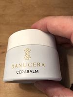 Front of Danucera Cerabalm jar showing logo and product name.