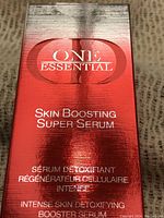 Photo of the front of the reflective red and silver box showing product name and details.