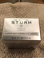 Top of box showing product name, brand, molecular cosmetics label and size 15 mL (0.5 fl. oz.)