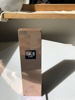 Front view of the SK-II LXP Ultimate Revival Essence box showing the brand and product name.