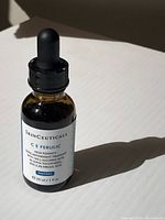 Front view of the Skinceuticals C E Ferulic serum amber glass dropper bottle showing the label with ingredients and volume.