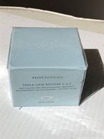 Front view of sealed SkinCeuticals Triple Lipid Restore 2:4:2 boxed product showing branding and product name.