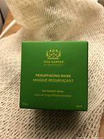 Front view of the green box of Tata Harper Resurfacing Mask showing product name and volume.