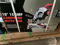 Photo of the closed box featuring the Tool Shop 10 inch 15 Amp compound miter saw with specifications.