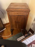 Full view of wooden cabinet with closed doors and flat top