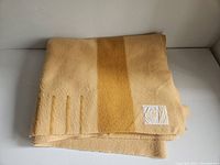 Folded vintage Hudson's Bay blanket showing the 4 point marks and texture