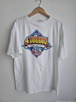 Front view of white T-shirt with colorful Toronto Blue Jays graphic and text commemorating 4,000,000 fans on October 4th, 1992