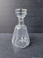 Front view of vintage Baccarat crystal whiskey decanter with stopper on.