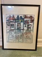 Full view of framed artwork leaning against wall