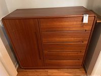 Full front view showing left cabinet door and four drawers