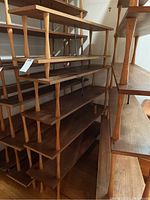 Overall view of both wood bookshelves side by side showing height difference and tapered legs