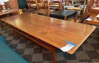 Angled view of full tabletop showing wood grain and overall condition