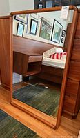 Full front view of rectangular wood-framed mirror