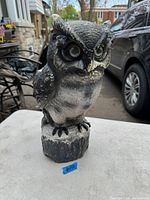 Front view of the large vintage owl figurine displaying detailed face and chest textures.