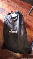 Black Coleman branded storage bag for the air mattress.