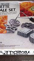 Box of Deluxe Rosette Pastry Set, showing images of pastry and molds on packaging.