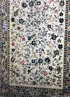 Close-up photo of the central area of the runner rug showing detailed floral pattern and colors.