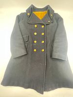 Front view of WW2 Canadian Navy double-breasted jacket with gold buttons and fur collar lining.