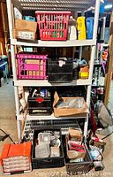 Full view of shelving unit with crates, boxes, and containers filled with screws and hardware supplies