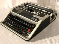 Front angled view of Olivetti Lettera 33 manual typewriter showing keyboard and brand plate