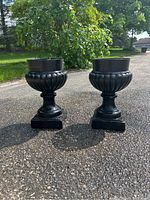 Front view of both urns on driveway showing overall appearance and paired design