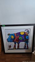 Full view of framed print featuring colorful stylized hog artwork with signature and numbering.