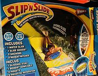 Front view of product packaging showing the Slip N Slide water slide and included items.