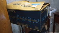 Box packaging of Sony CDP-CX450 400 Disc CD Changer player, showing branding and product model.