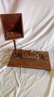 Full view of telegraph key and sounder assembly with upright wooden box
