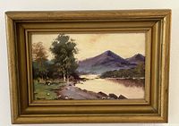 Front view of framed oil painting on board signed by artist Prof. Swift showing a riverside landscape with mountains in the background.