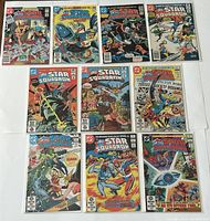 Front covers of the full set of All-Star Squadron comics, issues #1-10, displayed in two rows in protective sleeves.