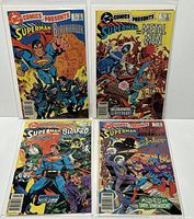 Four DC Comics Presents issues (#69-72) standing upright showing full front cover artwork featuring Superman and guest characters.