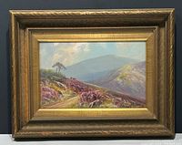 Frontal view of entire framed painting showing gilt wood frame and landscape scene