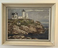 Full frontal view of framed oil painting showing lighthouse scene