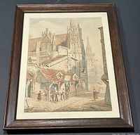 Front view of framed watercolour painting featuring Rouen street and cathedral.