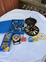 Full lot overview showing blue and black organizers with multiple cars, boxed set, tin, and plastic cases