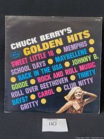 Front cover of Chuck Berry's Golden Hits vinyl LP with colorful text and image of a woman.