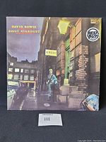 Front cover of David Bowie Ziggy Stardust vinyl album sleeve showing artist standing on street at night, RCA Best Buy Series logo visible.