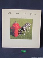 Front album cover with Dalmatian dog and fire hydrant image