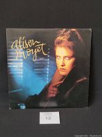 Front cover of Alison Moyet's album 'Alf' showing the artist's portrait and album title.