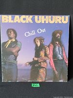 Front cover of Black Uhuru 'Chill Out' vinyl LP album, showing members of the band and title text.