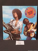 Front cover of The Brothers Johnson Look Out for #1 vinyl LP showing two musicians, one with a guitar and the other with bass, with album title and promo sticker.